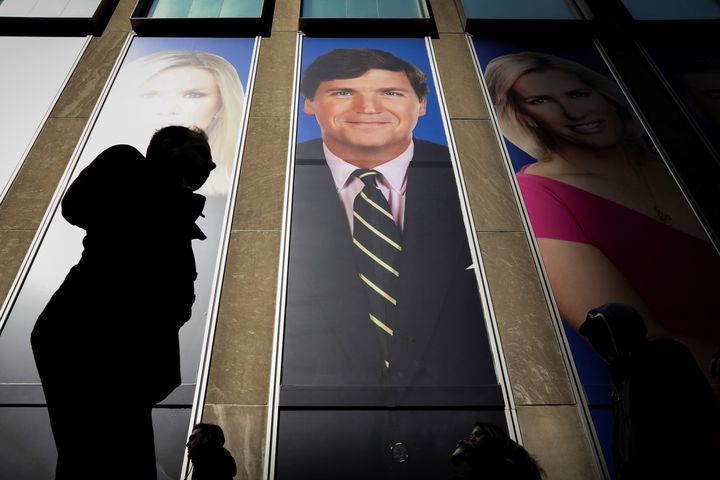 Fox News host Tucker Carlson, pictured on the News Corp building in New York, didn't mention Olivia Troye's condemnation of the Trump administration.