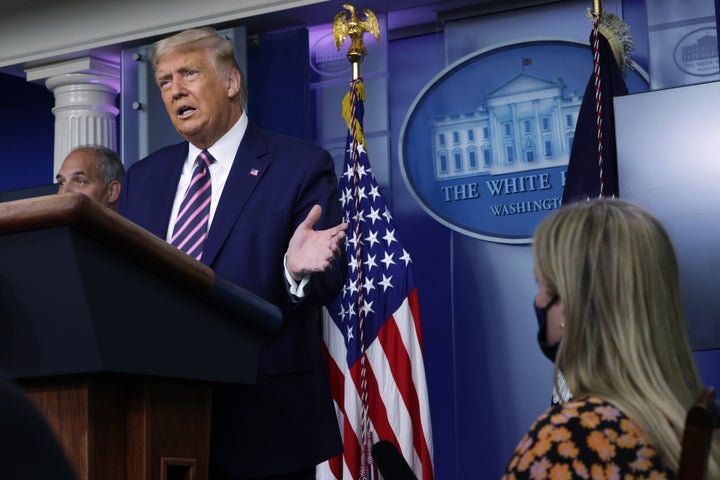 President Donald Trump holds a White House news conference Friday. A new HuffPost/YouGov poll indicates 51% of Americans disa