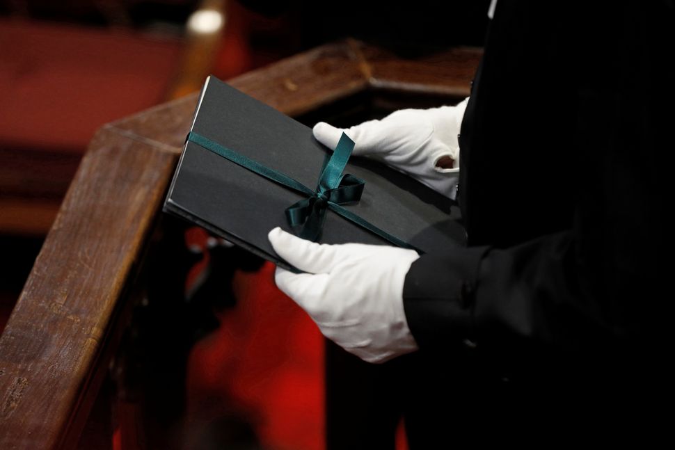 Speaker of the House of Commons Liberal Ontario MP Anthony Rota holds a copy of the throne speech in the Senate in Ottawa on Dec. 5, 2019.