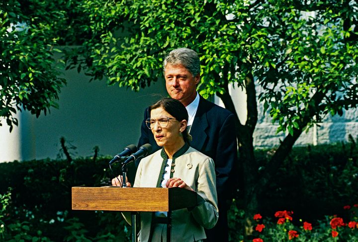 Newly confirmed by the Senate Judiciary Committee as associate justice of the Supreme Court, Ruth Bader Ginsburg addresses the news media as President Bill Clinton joins her in the White House Rose Garden on Aug. 3, 1993.