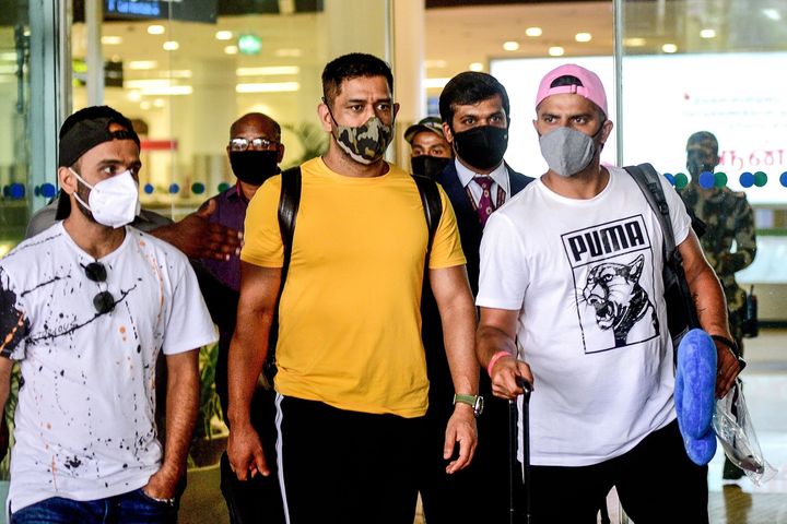 In this photograph taken on August 14, 2020, former Captain of Indian cricket team and Captain of Chennai Super Kings, Mahendra Singh Dhoni (C), arrives from Ranchi at Birsa Munda International Airport ahead of a training session for the upcoming Indian Premier League (IPL), in Chennai.