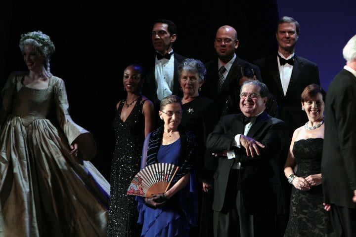 Justice Ruth Bader Ginsburg, center, and Justice Antonin Scalia, center right, appear on stage on the opening night of the Washington National Opera production of "Ariadne auf Naxos" at the John F. Kennedy Center for the Performing Arts in Washington in October 2009.