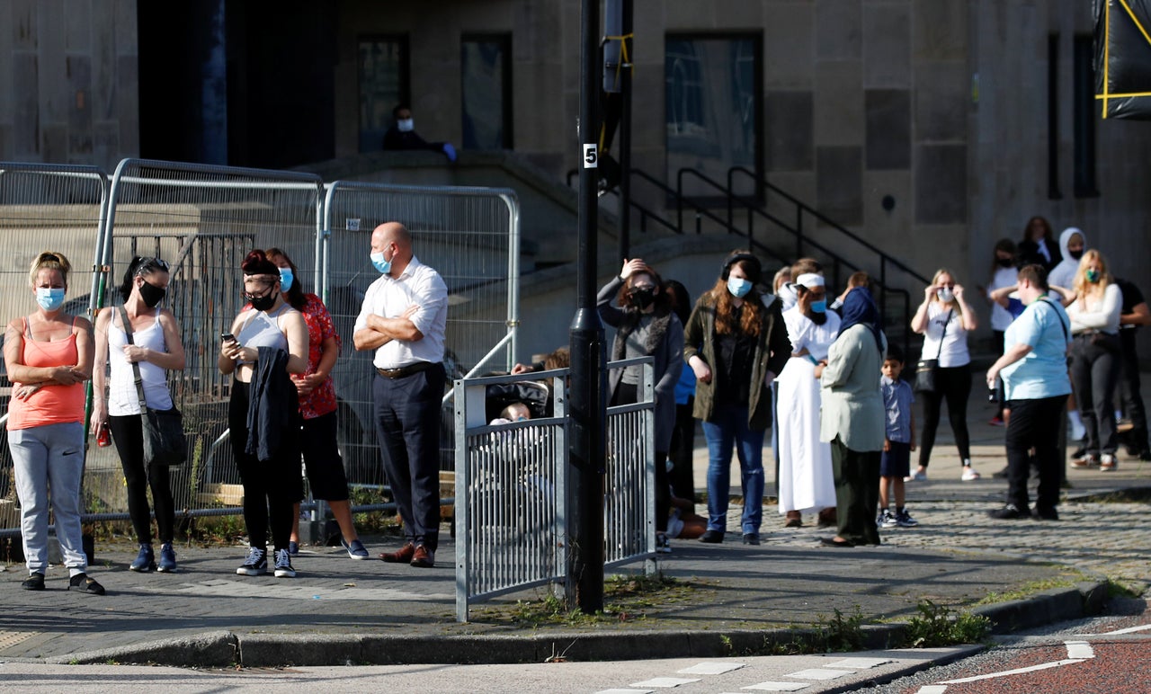 People queue outside a test center to take a coronavirus test in Bolton, in the northwest of England, Sept. 17. At more than 40,000, the U.K.'s COVID-19 death toll is the highest in Europe.