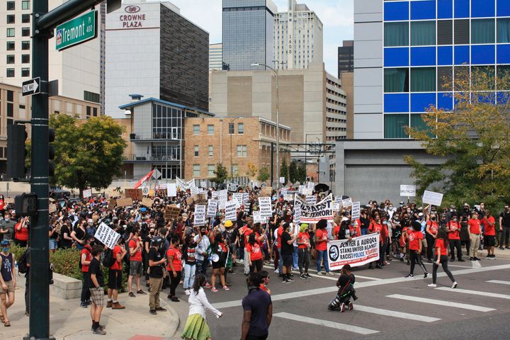 Protesters through downtown Denver toward government buildings during the Drop the Charges march and rally. (Photo by Madeleine Kelly/NurPhoto