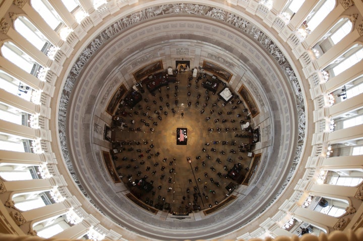 The casket of civil rights pioneer Representative John Lewis is placed by a US military honor guard at the centre of the Capitol Rotunda to lie in state in Washington, DC, July 27, 2020.