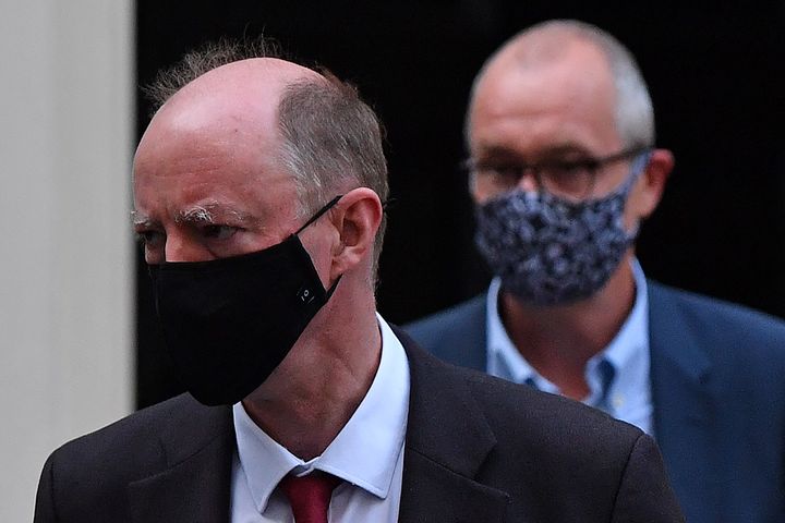 Britain's Chief Medical Officer for England Chris Whitty (L) and Britain's Chief Scientific Adviser Patrick Vallance leave from 11 Downing Street.