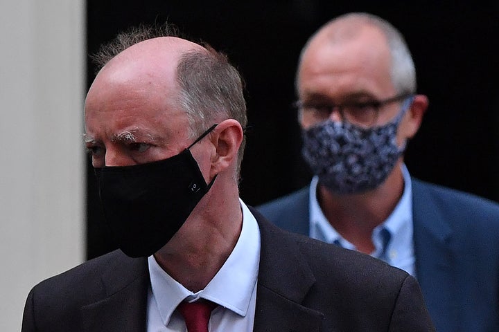 Britain's Chief Medical Officer for England Chris Whitty (L) and Britain's Chief Scientific Adviser Patrick Vallance leave from 11 Downing Street.