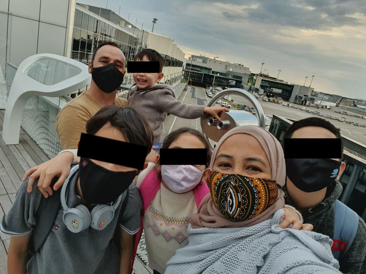 The Nelson family (above) was trapped inside Germany’s Frankfurt am Main Airport after a transit policy oversight by a travel agent. This was their first taste of fresh air in four days. (The family asked that the children's faces be obscured.)