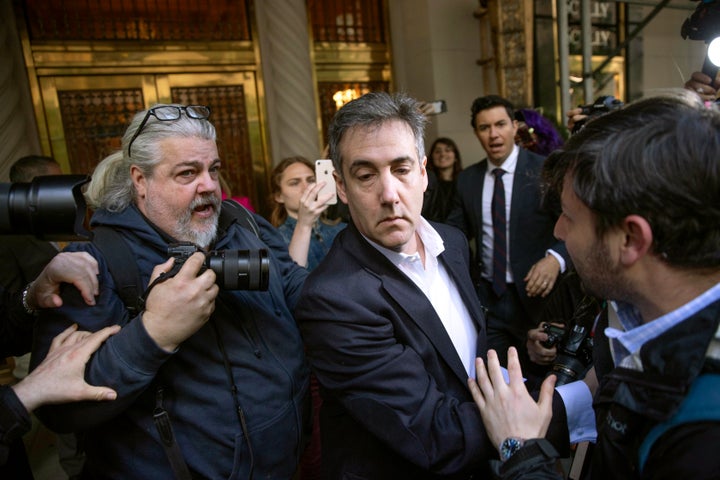 Michael Cohen, former attorney to President Donald Trump, leaves his apartment building before beginning his prison term Monday, May 6, 2019, in New York. AP Photo/Kevin Hagen)