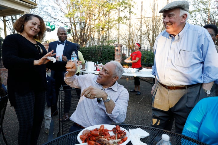 Mike Espy (center), the Democratic nominee for a Senate seat in Mississippi, attempts to fist bump at a crawfish boil in Jack