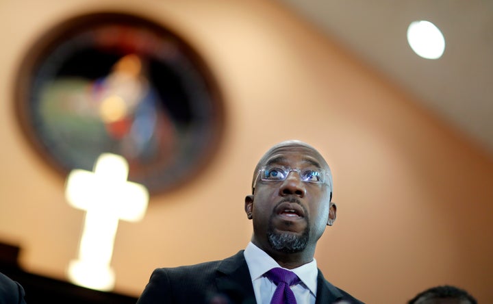 Rev. Raphael Warnock responds to President Donald Trump's comments about Haiti and Africa while speaking at Ebenezer Baptist Church on Jan. 12, 2018. Warnock and other faith leaders condemned Trump's "vile and racist" remarks made on the eve of the Martin Luther King Jr. holiday weekend. Warnock said it's hypocritical for Trump to sign a proclamation honoring King, given his comments. "A giant of a man does not need a proclamation from a small man like Donald Trump," he said.