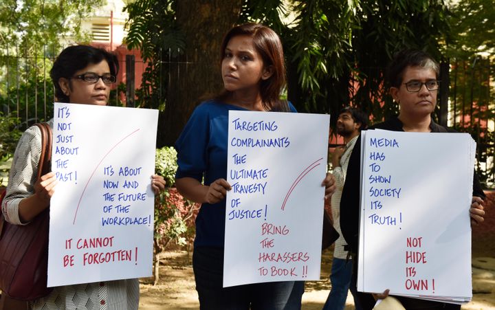 NEW DELHI, INDIA - OCTOBER 13: Electronic and Print media journalists stand to protest against the sexual harassment at the workplaces as part of the #MeToo campaign at Parliament Street, on October 13, 2018 in New Delhi, India. The protesting journalists also sought immediate action against those facing allegations of sexual misconduct. (Photo by Mohd Zakir/Hindustan Times via Getty Images)