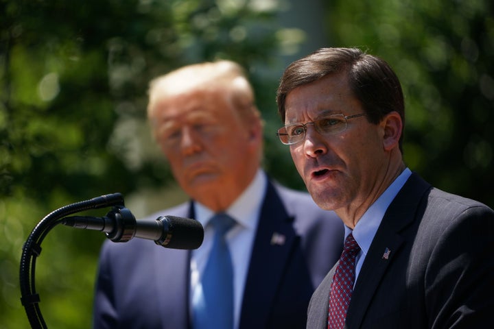 Defense Secretary Mark Esper, with President Donald Trump, speaks on vaccine development on May 15, 2020, in the Rose Garden of the White House.