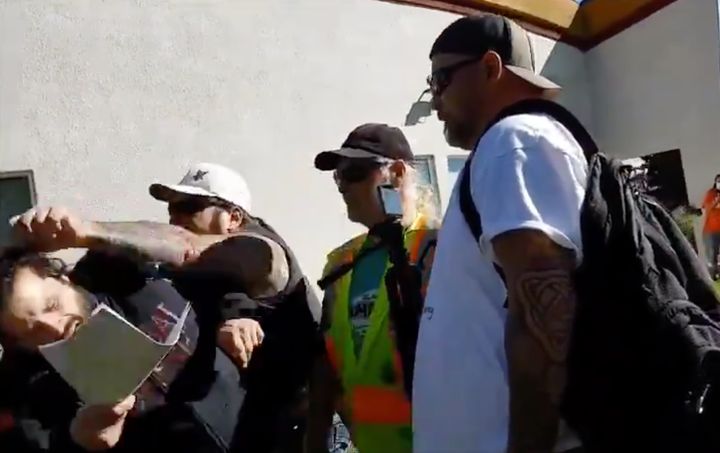 A screenshot from a video shared to Twitter showing physical altercations that occurred after far-right counter-protesters crashed a Red Deer anti-racism event. 
