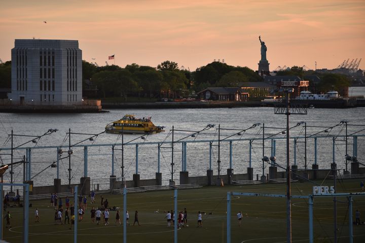 A planned statue of Ginsburg may get a view of the Statue of Liberty like this soccer field in Brooklyn Bridge Park enjoys.