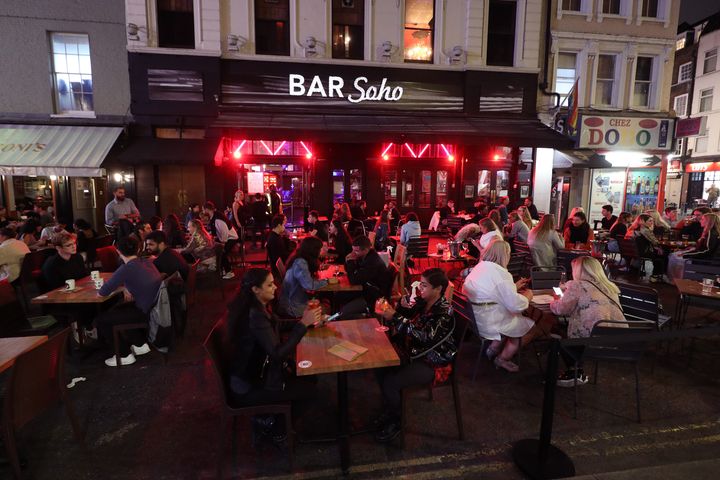 Late-night drinkers after 10pm in Soho, London, after Prime Minister Boris Johnson announced that from Thursday pubs and restaurants will be subject to a 10pm curfew to combat the rise in coronavirus cases in England.