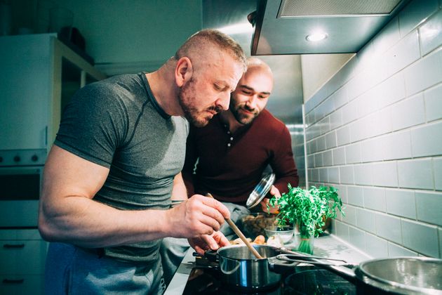 Couple preparing a meal in the kitchen.