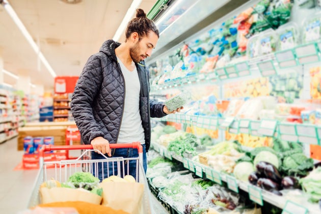 Young Man Shopping For Groceries.