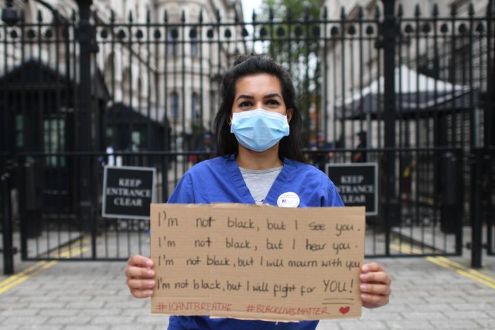 Nurse Ameera Sheikh protests outside Downing Street, London, demanding a pay rise, real protection against COVID-19 and and the release of Public Health England's review into BAME NHS staff's deaths.
