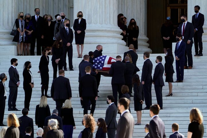 The flag-draped casket of Justice Ruth Bader Ginsburg is carried up the steps of the Supreme Court in Washington, Wednesday, Sept. 23, 2020. Ginsburg, 87, died of cancer on Sept. 18. (AP Photo/Susan Walsh)