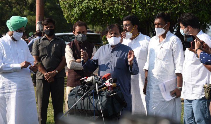 Congress MP Ahmed Patel, with other MPs, addresses the media after the passing of two farm bills in Rajya Sabha on 20 September, 2020.