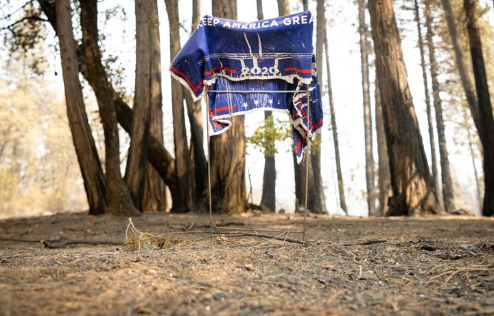 A melted pro-Trump sign stands close to a Northern California residence destroyed by one of the many wildfires that raged through the state in the late summer. Visiting California earlier this month, Trump suggested that global warming will reverse itself and dismissed climate change as a cause of the ferocious fires that engulfed swaths of the West.