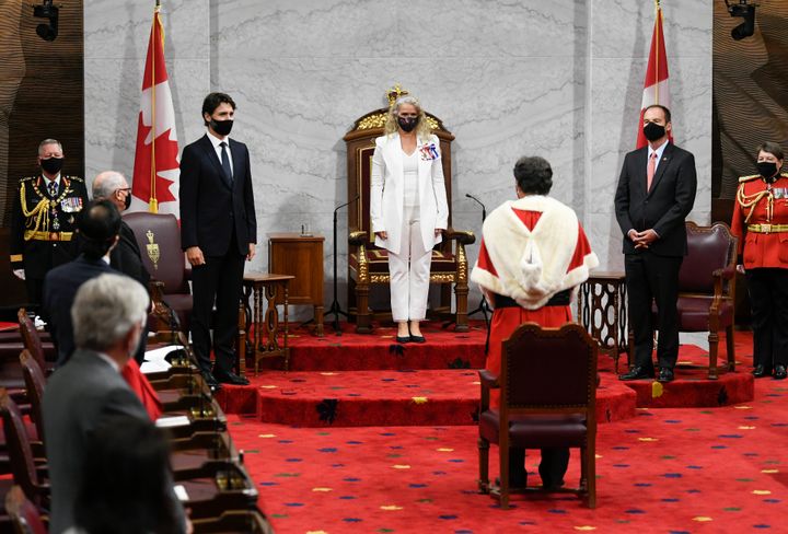 Gov. Gen. Julie Payette, middle, stands with Chief of Defence Staff Jonathan Vance, left to right, Prime Minister Justin Trudeau, Senator Marc Gold, and RCMP Commissioner Brenda Lucki during the throne speech in the Senate chamber in Ottawa on Wednesday.