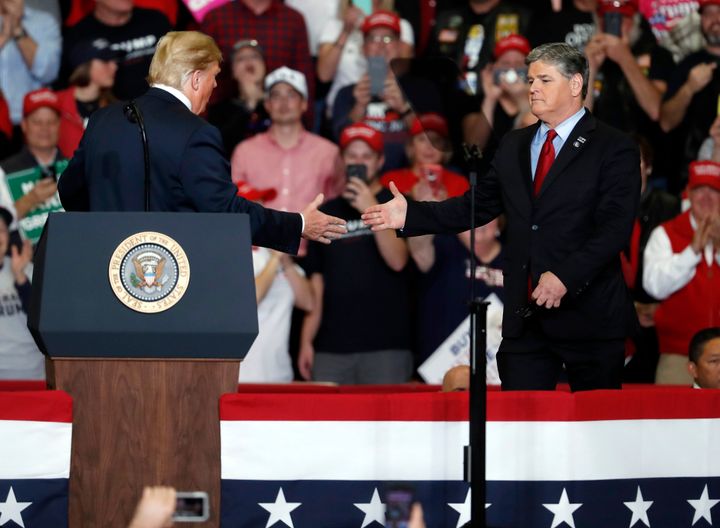 Sean Hannity lauded President Donald Trump and slammed other members of the media while on stage with the president at a campaign rally in Cape Girardeau, Missouri, in November 2018.