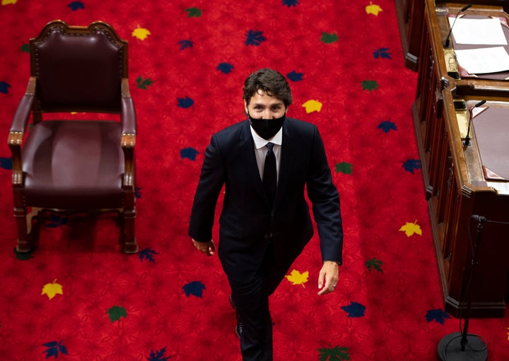 Prime Minister Justin Trudeau heads back to his seat before the delivery of the throne speech at the Senate of Canada Building in Ottawa, on Sept. 23, 2020. 