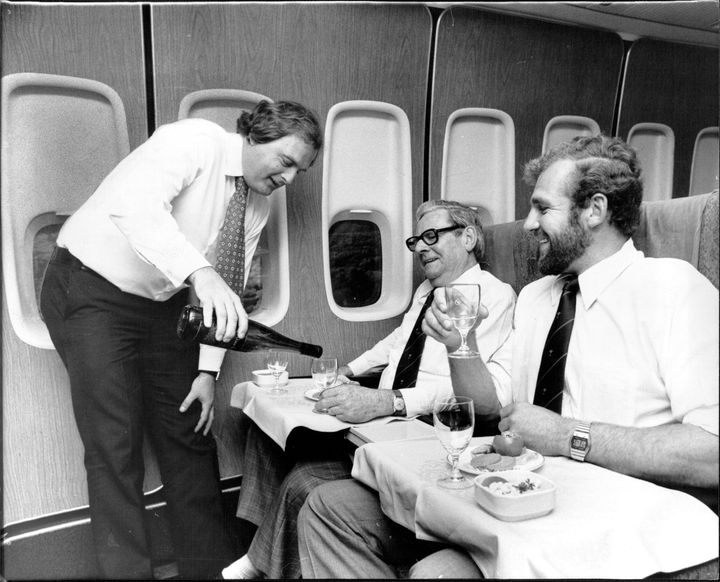 John Fordham, Qantas' marketing promotions manager, serves the president of the Australian Rugby Union, Bill McLaughlin, and player Greg Cornelsen in 1979.