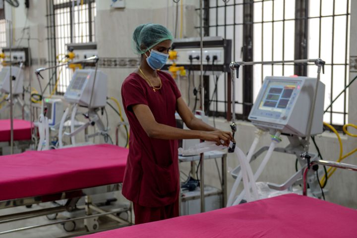 A medical staff checks on a ventilator of an intensive care unit at a newly inaugurated hospital.