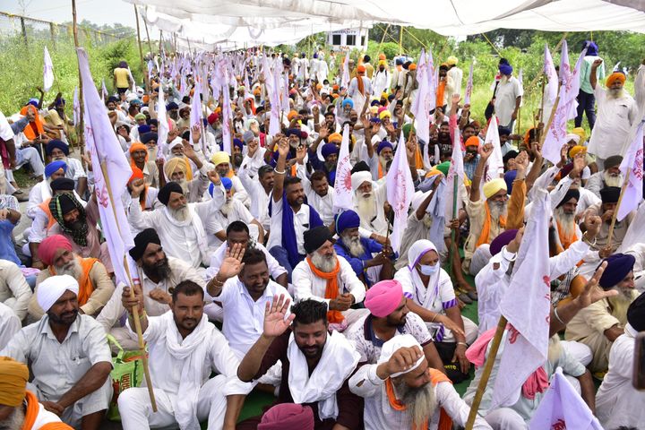 Farmers raise slogans during a protest at Beas Bridge against the three agriculture ordinances on September 14, 2020 in Amritsar.