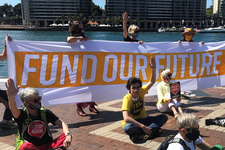 Ambrose Hayes (in yellow), a 15-year-old climate change activist, takes part in an event as part of the Fund Our Future Not Gas climate rally in Sydney, Australia, September 25, 2020. 