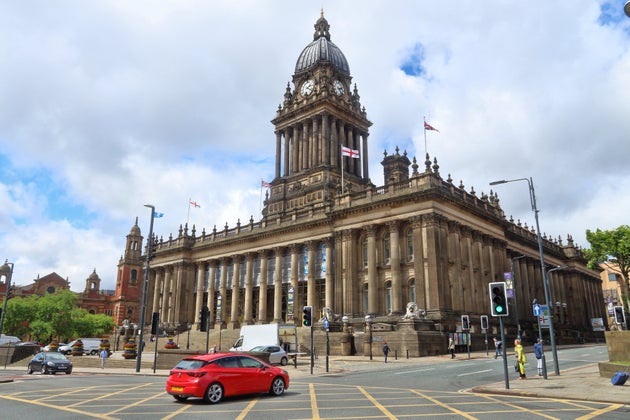 People visit City Hall in Leeds, UK