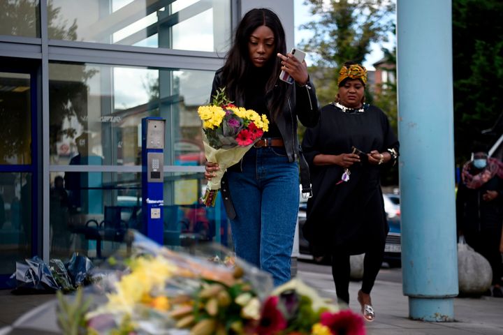 Floral tributes are placed outside the Croydon Custody Centre in south London on September 25, 2020.