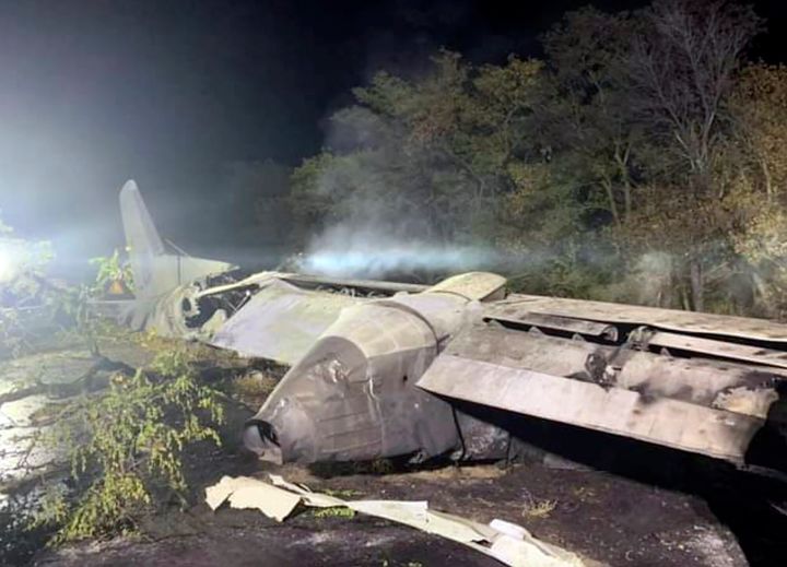 In this photo released by Kharkiv Regional State Administration, wreckage of an AN-26 military plane seen after it crashed in