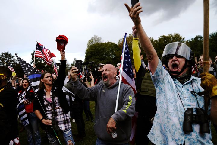 Members of the Proud Boys and other right-wing demonstrators rally on Saturday in Portland, Ore.