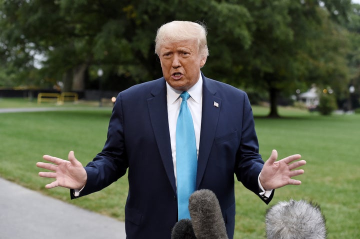 President Donald Trump speaks to reporters outside the White House on Saturday.