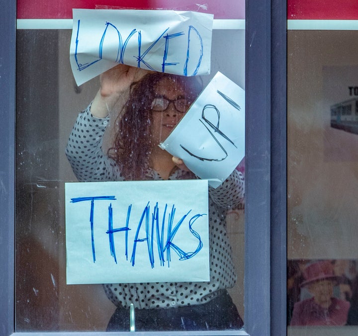 Signs posted on a window at Manchester Metropolitan University's Birley campus, on Monday