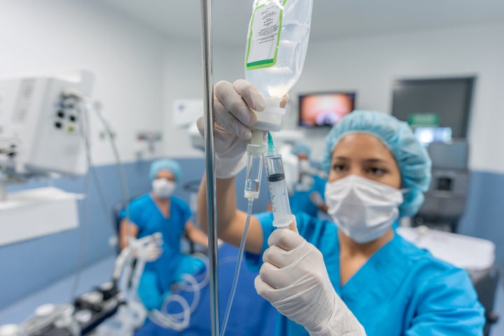 Doctors set up an IV system in this undated stock photo. The chances of dying before age 75 from avoidable causes has been declining faster for wealthy Canadians than they have been for lower-income people.