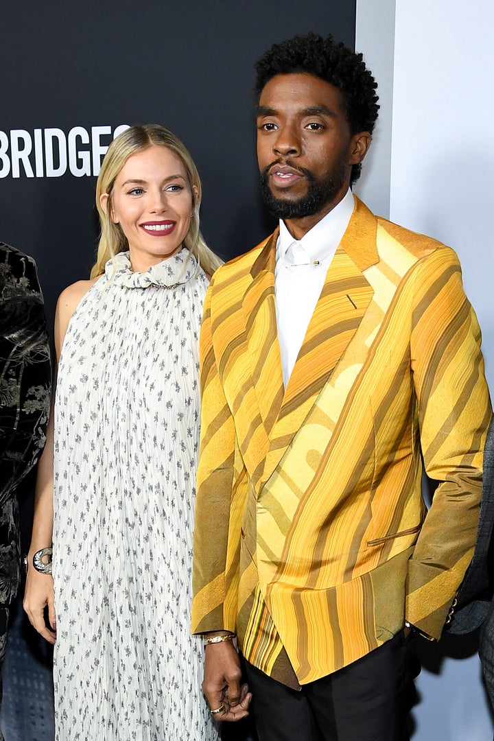 Sienna Miller and Chadwick Boseman attend a screening of "21 Bridges" in November 2019, in which they both starred. In a new interview, Miller details an act of generosity on Boseman's part that took her by surprise.