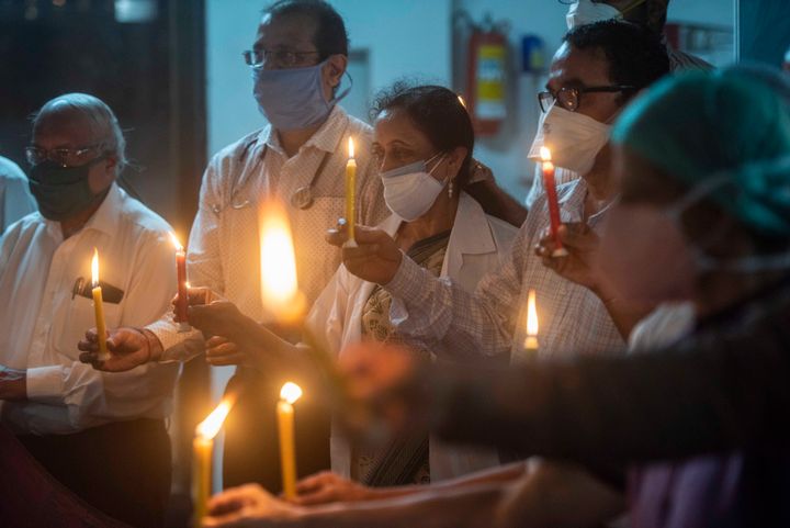 PUNE, INDIA - SEPTEMBER 11: Doctors and members of Indian Medical Association Pune pay tribute by lighting up candles to the fellow martyr doctors, who died while doing their duties in treating Covid patients at Tilak road, on September 11, 2020 in Pune, India. (Photo by Pratham Gokhale/Hindustan Times via Getty Images)