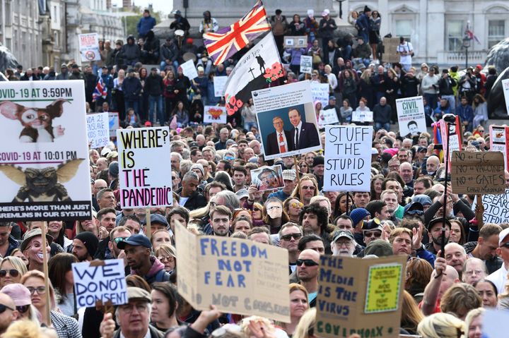 People take part in a 'We Do Not Consent' rally at Trafalgar Square, organised by Stop New Normal, to protest against coronavirus restrictions, in London, Saturday.