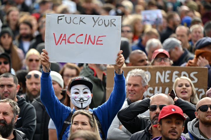 A protester holds up a placard in Trafalgar Square against vaccination and government restrictions designed to fight the spread of the novel coronavirus.
