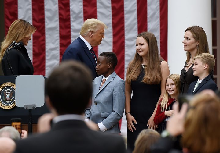 President Donald Trump with Judge Amy Coney Barrett as she and some of her children gather in the Rose Garden of the White House on Sept. 26, 2020.