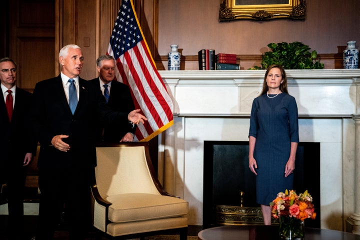 U.S. Vice President Mike Pence speaks during a meeting with Barrett. Some familiar with People of Praise and charismatic religious groups like it say Barrett’s involvement should be examined before she receives a lifelong appointment to the highest court in the nation. Erin Schaff/Pool via REUTERS