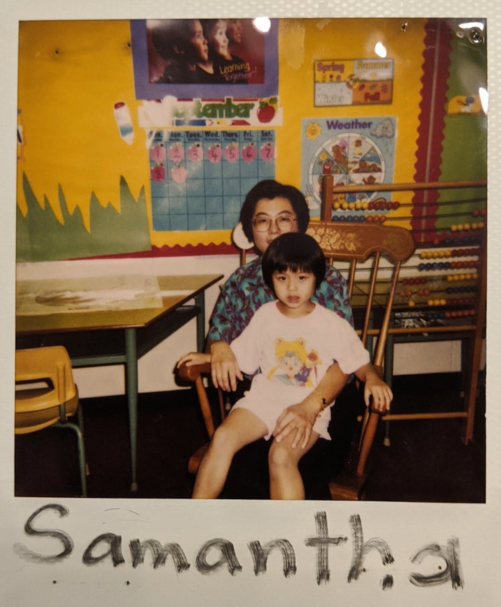 A family photo of the writer as a child, pictured seated on her immigrant mother's lap.