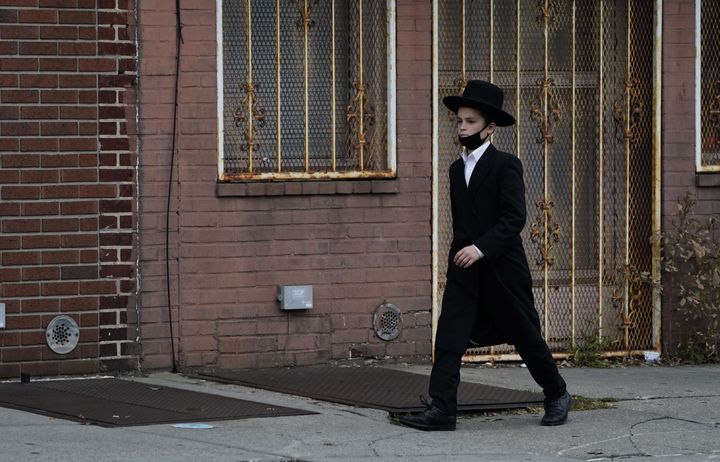 An Orthodox Jewish boy walks through his Brooklyn neighborhood on September 29, 2020, in New York. 
