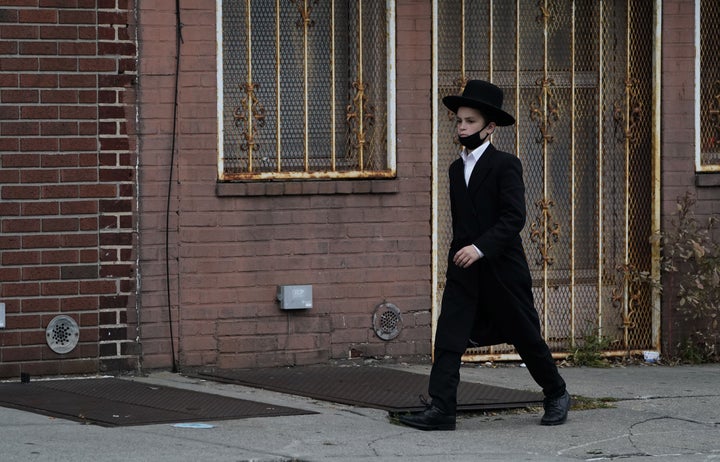 An Orthodox Jewish boy walks through his Brooklyn neighborhood on September 29, 2020, in New York.