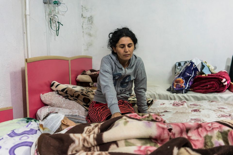 STEPANAKERT, NAGORNO-KARABAKH - SEPTEMBER 29: Anahit Gevorgyan sits with her son Artsvik, 2, after he was injured and her eight-year-old daughter was killed by fighting in their village of Martuni two days earlier, on September 29, 2020 in Stepanakert, Nagorno-Karabakh. Heavy fighting has taken place since Sunday morning in the territory, with both sides reporting military and civilian casualties in perhaps the worst violence since 2016. Since signing a ceasefire in a war with Azerbaijan in 1994, Nagorno-Karabakh, officially part of Azerbaijan, has functioned as a self-declared independent republic and de facto part of Armenia, with hostilities along the line of contact between Nagorno-Karabakh and Azerbaijan occasionally flaring up and causing casualties. (Photo by Brendan Hoffman/Getty Images)